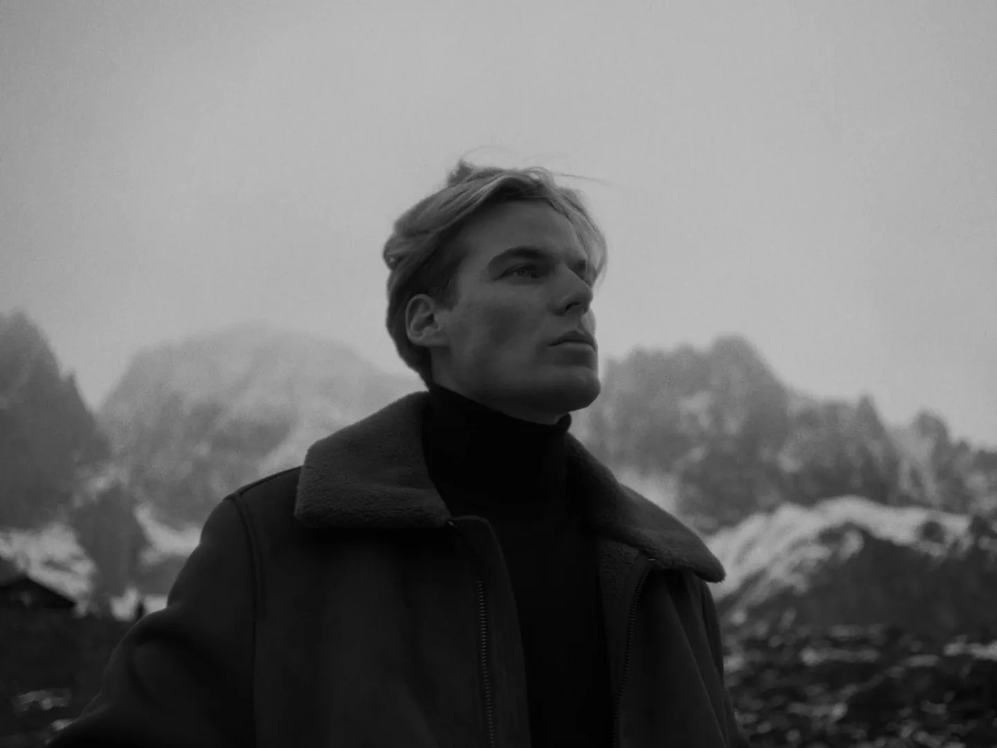 Character portrait against the mountain landscape